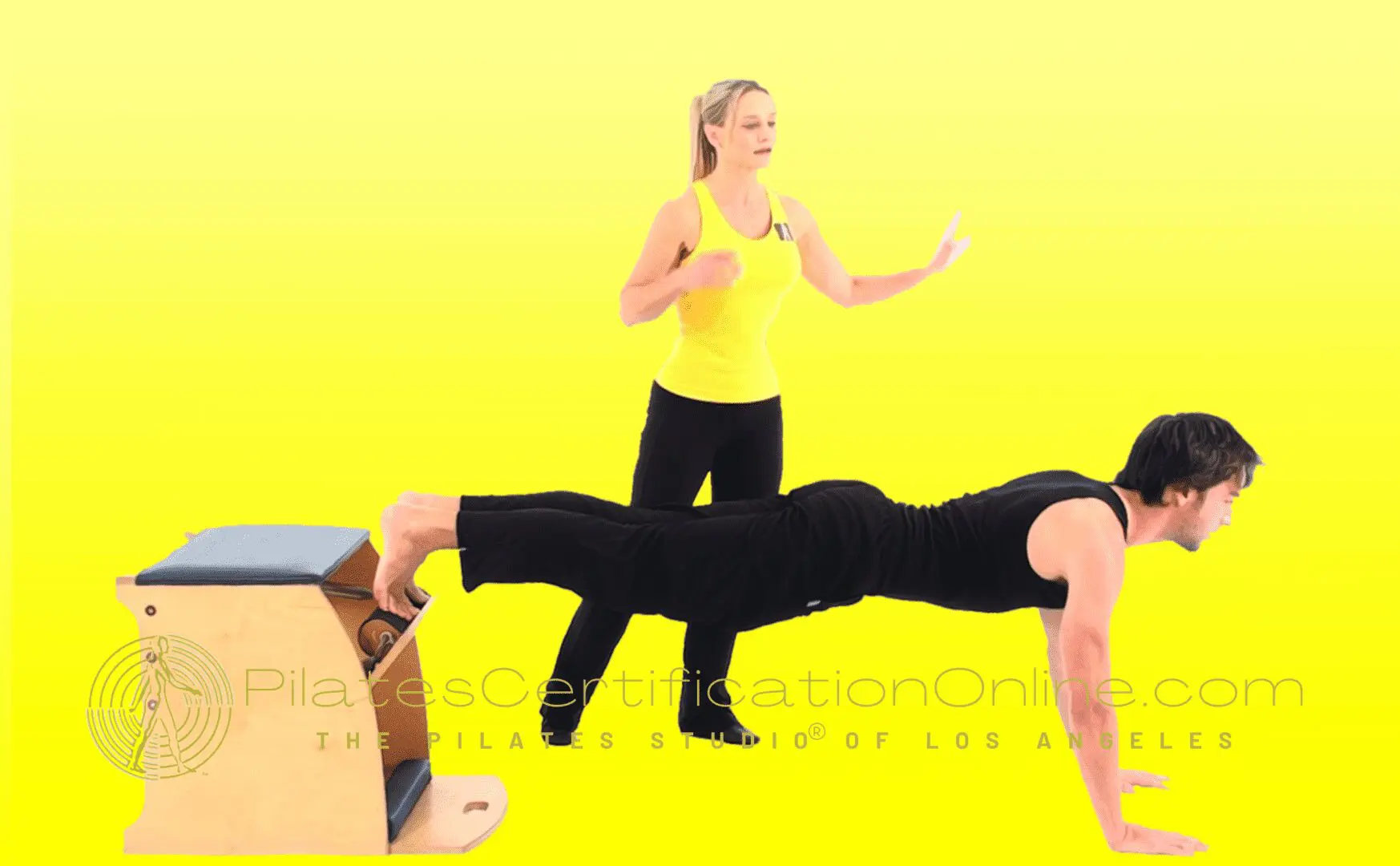 A woman is doing exercises with a trainer.