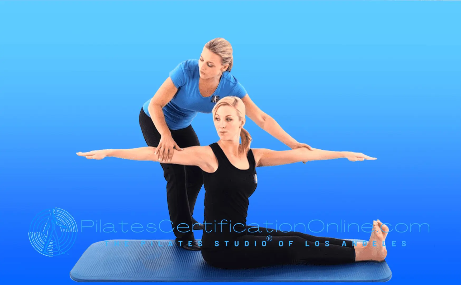 A woman is stretching on the floor with another person.