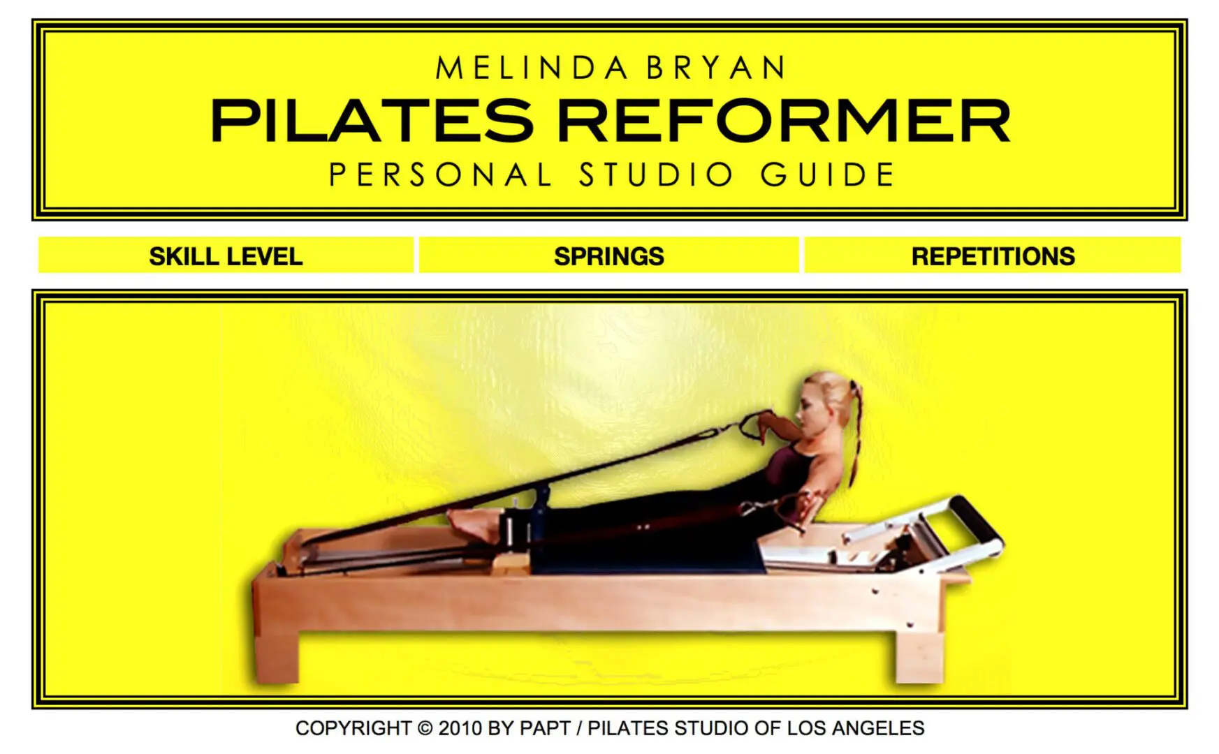 A woman is sitting on the back of a rowing machine.