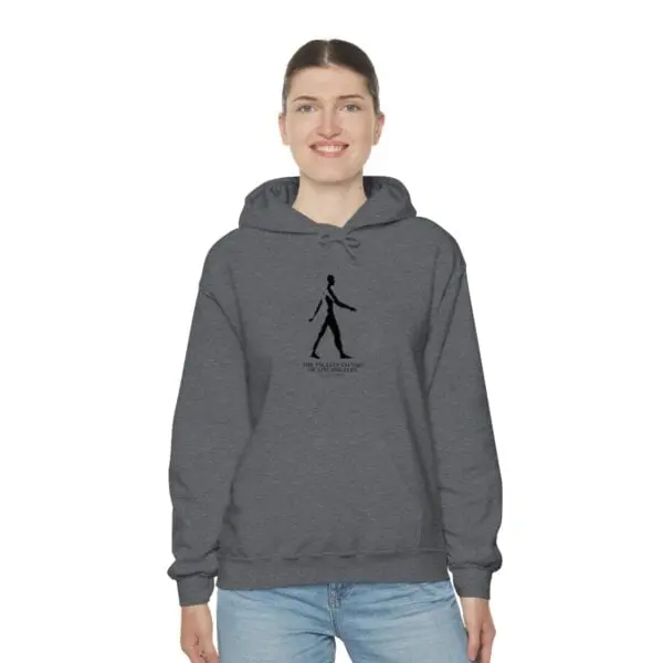 A woman wearing a gray hoodie with an image of a person walking.