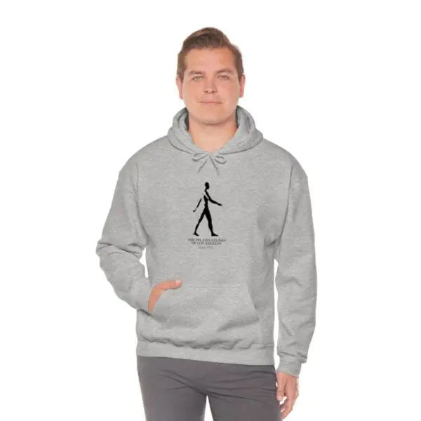 A man in grey hoodie with black logo