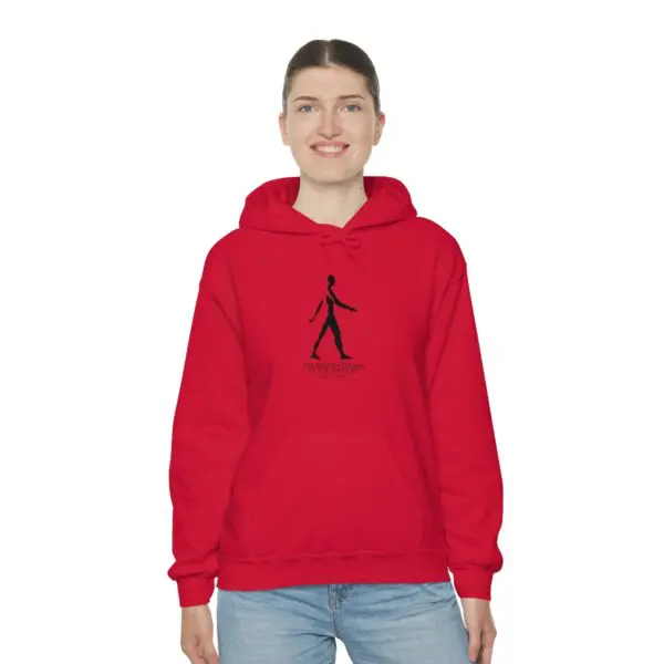 A person wearing a red hoodie with a black stick figure.