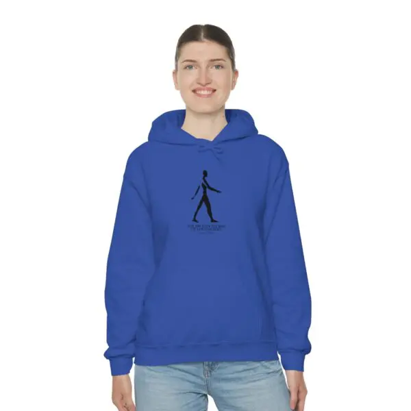 A woman wearing a blue hoodie with an image of a person walking.