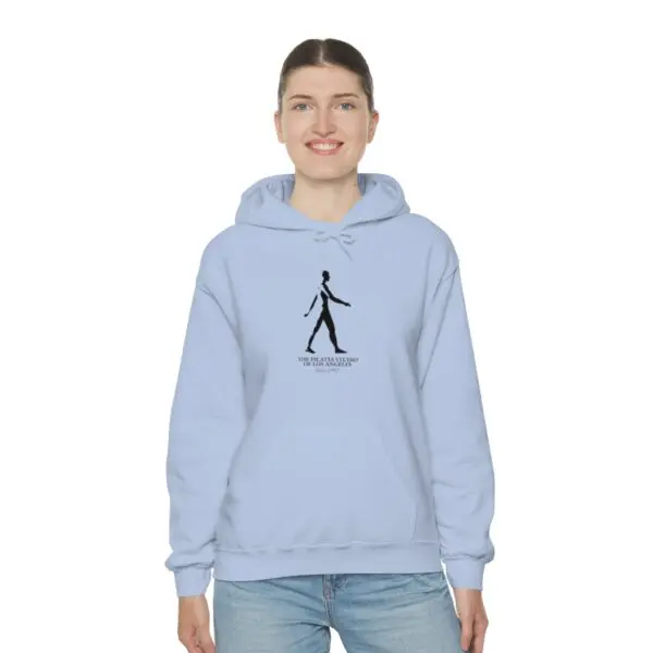 A woman is wearing a light blue hoodie