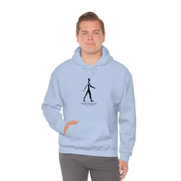 A man is wearing a light blue hoodie