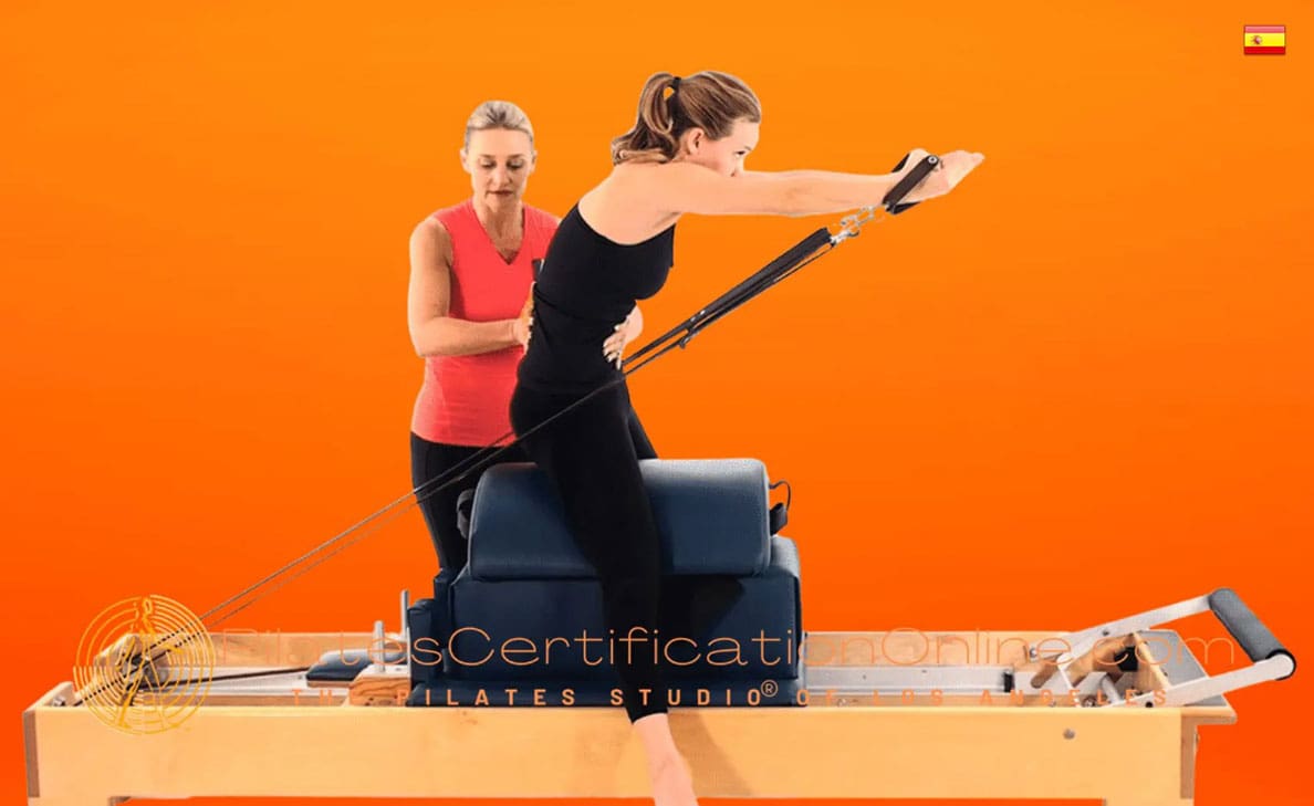 "Two women practicing Pilates on reformer."